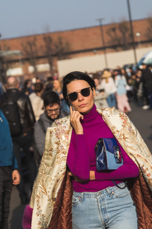 MILAN, ITALY - FEBRUARY 22: Fashionable woman poses outside Gucci fashion show building during Milan Women's Fashion Week on FEBRUARY 22, 2017 in Milan.のeditorial素材