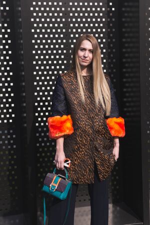 MILAN, ITALY - FEBRUARY 22: Fashionable woman poses outside Gucci fashion show building during Milan Women's Fashion Week on FEBRUARY 22, 2017 in Milan.のeditorial素材