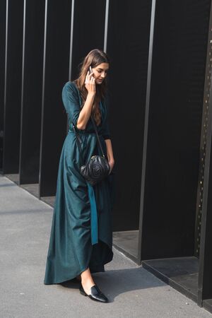 MILAN, ITALY - FEBRUARY 22: Fashionable woman poses outside Gucci fashion show building during Milan Women's Fashion Week on FEBRUARY 22, 2017 in Milan.のeditorial素材