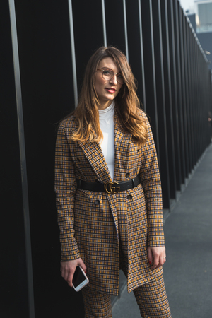 MILAN, ITALY - FEBRUARY 22: Fashionable woman poses outside Gucci fashion show building during Milan Women's Fashion Week on FEBRUARY 22, 2017 in Milan.のeditorial素材