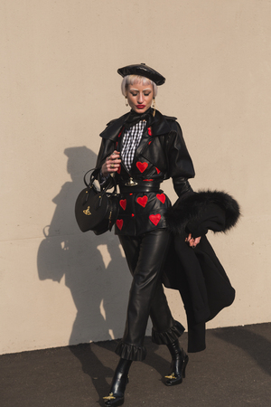 MILAN, ITALY - FEBRUARY 22: Fashionable woman poses outside Gucci fashion show building during Milan Women's Fashion Week on FEBRUARY 22, 2017 in Milan.のeditorial素材
