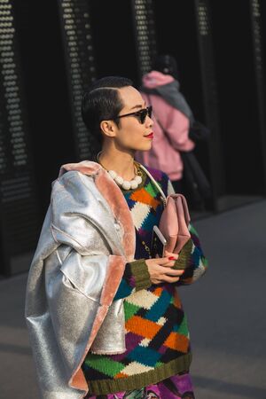 MILAN, ITALY - FEBRUARY 22: Fashionable woman poses outside Gucci fashion show building during Milan Women's Fashion Week on FEBRUARY 22, 2017 in Milan.のeditorial素材