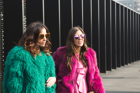 MILAN, ITALY - FEBRUARY 22: Fashionable women pose outside Gucci fashion show building during Milan Women's Fashion Week on FEBRUARY 22, 2017 in Milan.のeditorial素材