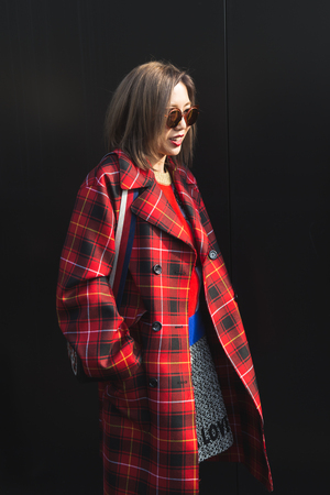 MILAN, ITALY - FEBRUARY 22: Fashionable woman poses outside Gucci fashion show building during Milan Women's Fashion Week on FEBRUARY 22, 2017 in Milan.のeditorial素材