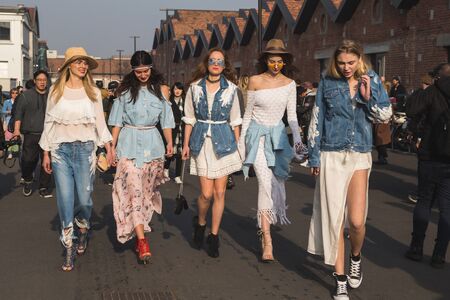 MILAN, ITALY - FEBRUARY 22: Fashionable women pose outside Gucci fashion show building during Milan Women's Fashion Week on FEBRUARY 22, 2017 in Milan.のeditorial素材