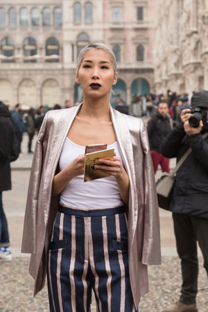 MILAN, ITALY - FEBRUARY 23: Fashionable woman poses outside Genny fashion show during Milan Women's Fashion Week on FEBRUARY 23, 2017 in Milan.のeditorial素材