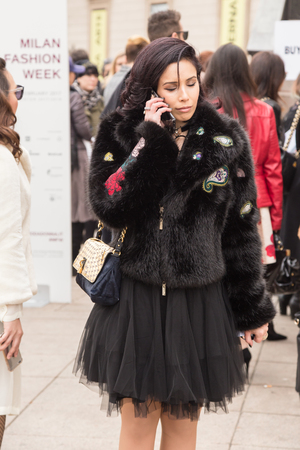MILAN, ITALY - FEBRUARY 23: Fashionable woman poses outside Genny fashion show during Milan Women's Fashion Week on FEBRUARY 23, 2017 in Milan.のeditorial素材