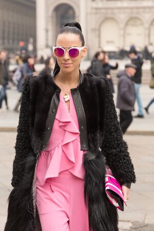 MILAN, ITALY - FEBRUARY 23: Fashionable woman poses outside Genny fashion show during Milan Women's Fashion Week on FEBRUARY 23, 2017 in Milan.のeditorial素材