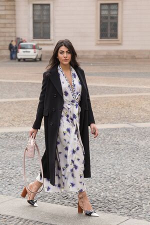 MILAN, ITALY - FEBRUARY 23: Fashionable woman poses outside Genny fashion show during Milan Women's Fashion Week on FEBRUARY 23, 2017 in Milan.のeditorial素材