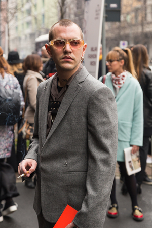 MILAN, ITALY - FEBRUARY 24: Fashionable man poses outside Etro fashion show during Milan Women's Fashion Week on FEBRUARY 24, 2017 in Milan.のeditorial素材