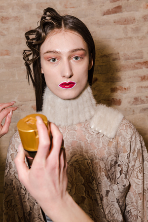 MILAN, ITALY - FEBRUARY 27: Gorgeous model poses in the backstage just before Alberto Zambelli show during Milan Women's Fashion Week on FEBRUARY 27, 2017 in Milan.のeditorial素材