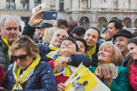 MILAN, ITALY - MARCH 25, 2016: Pilgrims gather downtown to welcome His Holiness Pope Francis during...