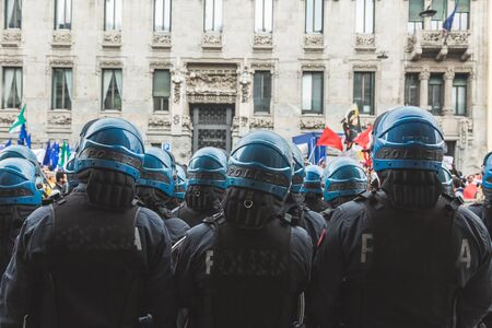 MILAN, ITALY - APRIL 25: Riot policemen follow the Liberation Day parade, end of Mussolini's regime and Nazi occupation in 1945 on APRIL 25, 2017 in Milan.のeditorial素材