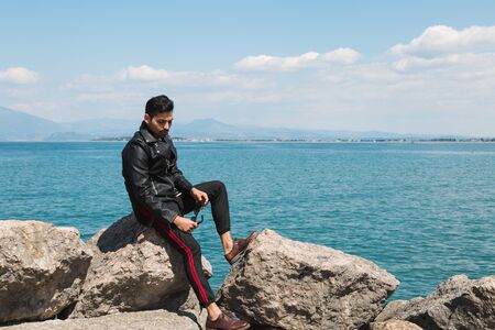 Handsome Indian man posing in a vacation context. Street fashion and style.の写真素材