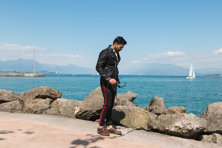Handsome Indian man posing in a vacation context. Street fashion and style.の写真素材