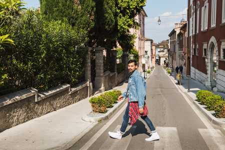 Handsome Indian man posing in an urban context. Street fashion and style.の写真素材