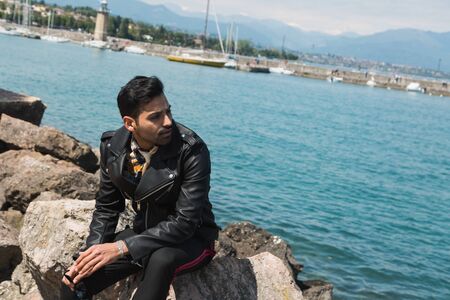Handsome Indian man posing in a vacation context. Street fashion and style.の写真素材