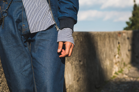 Detail of a man posing in a vacation context. Street fashion and style in summer.の写真素材