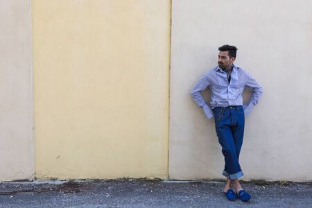 Handsome Indian man posing in an urban context. Street fashion and style.の写真素材