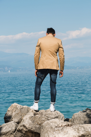 Man looking at the horizon. Concept of solitude and depression.の写真素材
