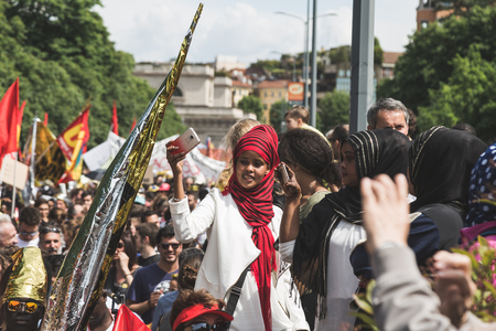MILAN, ITALY - MAY 20, 2017: One hundred thousand people take part in a peaceful demonstration laying claim to rights and hospitality for immigrants and refugees.のeditorial素材