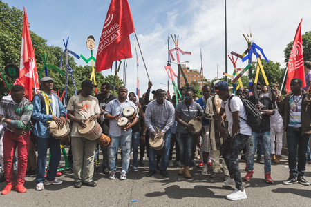MILAN, ITALY - MAY 20, 2017: One hundred thousand people take part in a peaceful demonstration laying claim to rights and hospitality for immigrants and refugees.のeditorial素材