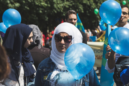 MILAN, ITALY - MAY 20, 2017: One hundred thousand people take part in a peaceful demonstration laying claim to rights and hospitality for immigrants and refugees.のeditorial素材