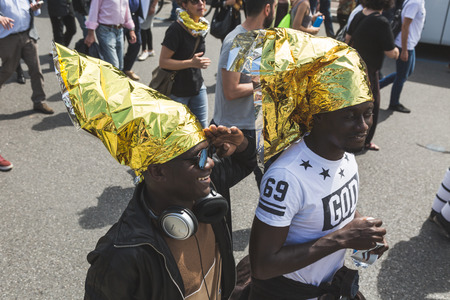 MILAN, ITALY - MAY 20, 2017: One hundred thousand people take part in a peaceful demonstration laying claim to rights and hospitality for immigrants and refugees.のeditorial素材