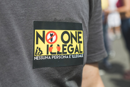 MILAN, ITALY - MAY 20, 2017: One hundred thousand people take part in a peaceful demonstration laying claim to rights and hospitality for immigrants and refugees.のeditorial素材