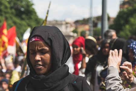 MILAN, ITALY - MAY 20, 2017: One hundred thousand people take part in a peaceful demonstration laying claim to rights and hospitality for immigrants and refugees.のeditorial素材