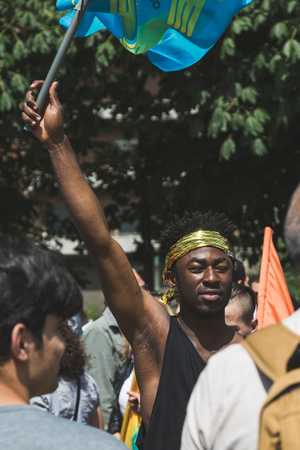 MILAN, ITALY - MAY 20, 2017: One hundred thousand people take part in a peaceful demonstration laying claim to rights and hospitality for immigrants and refugees.のeditorial素材