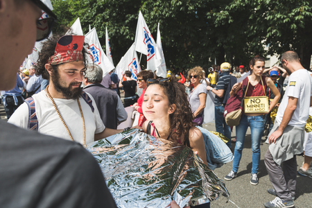 MILAN, ITALY - MAY 20, 2017: One hundred thousand people take part in a peaceful demonstration laying claim to rights and hospitality for immigrants and refugees.のeditorial素材