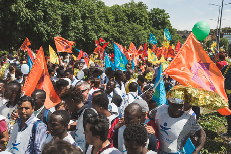 MILAN, ITALY - MAY 20, 2017: One hundred thousand people take part in a peaceful demonstration laying claim to rights and hospitality for immigrants and refugees.のeditorial素材