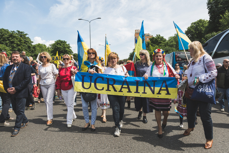 MILAN, ITALY - MAY 20, 2017: One hundred thousand people take part in a peaceful demonstration laying claim to rights and hospitality for immigrants and refugees.のeditorial素材