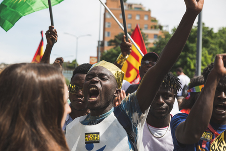 MILAN, ITALY - MAY 20, 2017: One hundred thousand people take part in a peaceful demonstration laying claim to rights and hospitality for immigrants and refugees.のeditorial素材