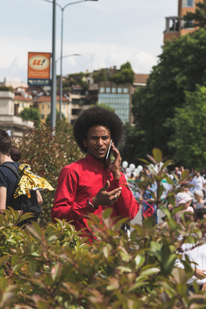 MILAN, ITALY - MAY 20, 2017: One hundred thousand people take part in a peaceful demonstration laying claim to rights and hospitality for immigrants and refugees.のeditorial素材