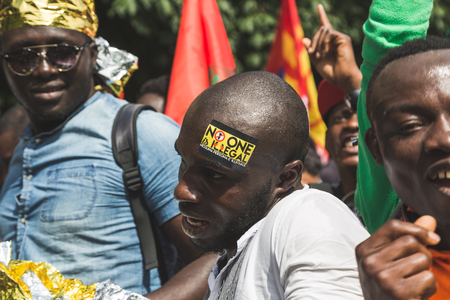 MILAN, ITALY - MAY 20, 2017: One hundred thousand people take part in a peaceful demonstration laying claim to rights and hospitality for immigrants and refugees.のeditorial素材