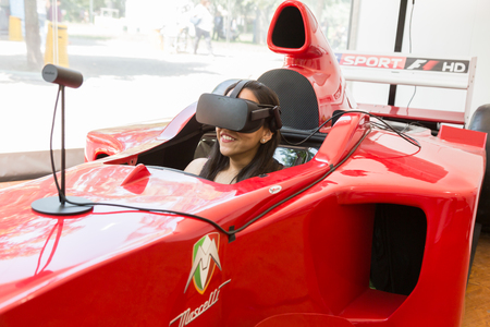MILAN, ITALY - MAY 26: Girl tries virtual reality headset at Wired Next Fest, event dedicated to future, innovation and creativity on MAY 26, 2017 in Milan.のeditorial素材
