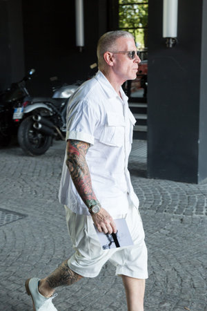 MILAN, ITALY - JUNE 17: Fashionable man poses outside Neil Barrett fashion show during Milan Men's Fashion Week on JUNE 17, 2017 in Milan.のeditorial素材
