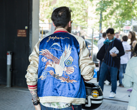 MILAN, ITALY - JUNE 17: Fashionable man poses outside Neil Barrett fashion show during Milan Men's Fashion Week on JUNE 17, 2017 in Milan.のeditorial素材