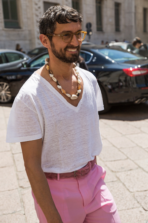 MILAN, ITALY - JUNE 18: Fashionable man poses outside Ferragamo fashion show during Milan Men's Fashion Week on JUNE 18, 2017 in Milan.のeditorial素材