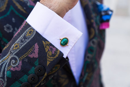 MILAN, ITALY - JUNE 18: Detail of a fashionable man outside Ferragamo fashion show during Milan...