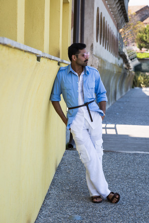 Handsome Indian man posing in a vacation context. Street fashion and style.の写真素材