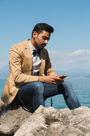 Handsome Indian man posing in a vacation context. Street fashion and style.の写真素材