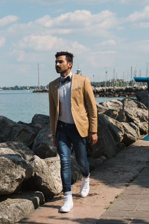 Handsome Indian man posing in a vacation context. Street fashion and style.の写真素材