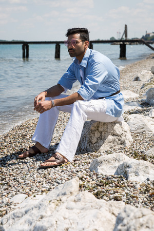 Handsome Indian man posing in a vacation context. Street fashion and style.の写真素材
