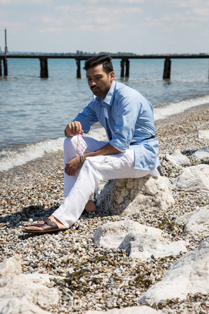 Handsome Indian man posing in a vacation context. Street fashion and style.の写真素材