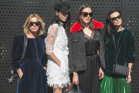 MILAN, ITALY - SEPTEMBER 20: Fashionable women pose outside Gucci fashion show building during Milan Women's Fashion Week on SEPTEMBER 20, 2017 in Milan.のeditorial素材