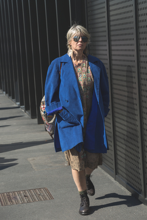 MILAN, ITALY - SEPTEMBER 20: Fashionable woman poses outside Gucci fashion show building during Milan Women's Fashion Week on SEPTEMBER 20, 2017 in Milan.のeditorial素材