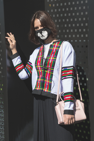 MILAN, ITALY - SEPTEMBER 20: Fashionable woman poses outside Gucci fashion show building during Milan Women's Fashion Week on SEPTEMBER 20, 2017 in Milan.のeditorial素材
